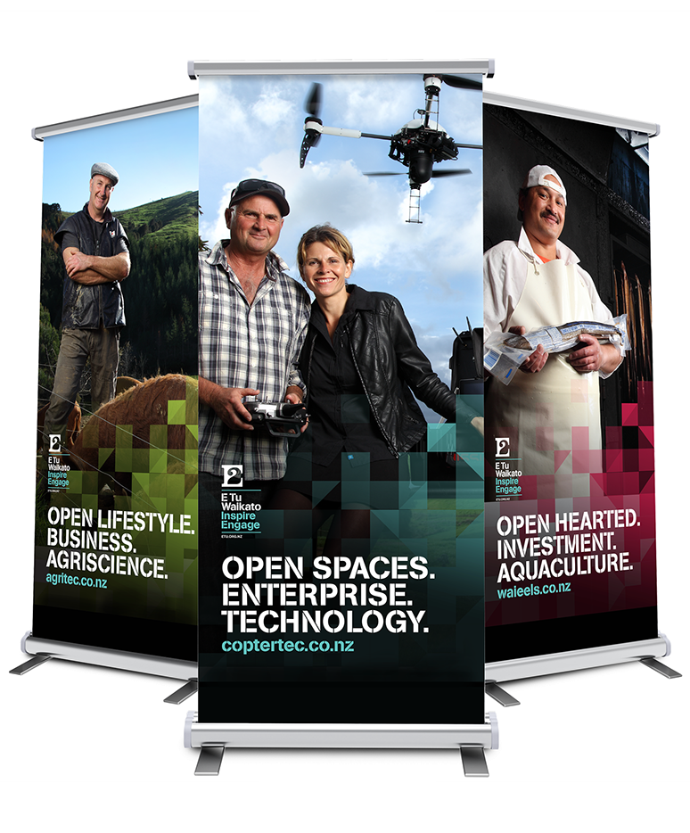 Three pull-up banners showcasing the various promotional photos and accompanying art.